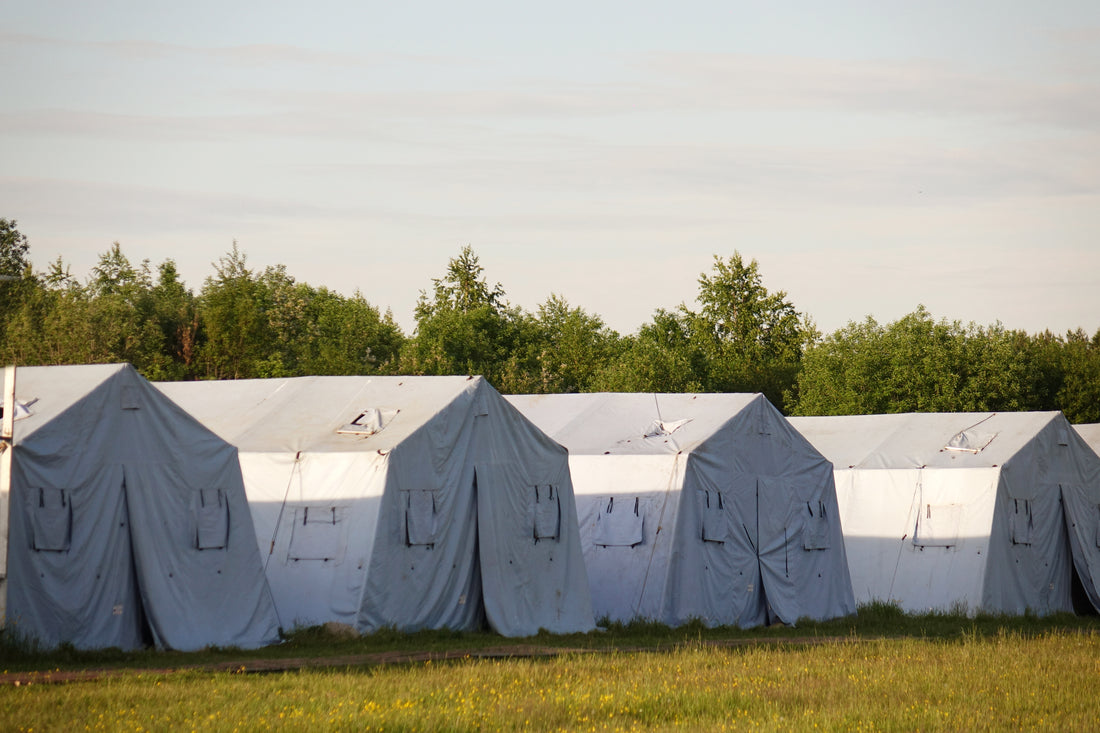 image of multiple camping tarps aligned on same line