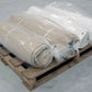 Image of horizontally stacked Beige & White 40x40 Tarps on wooden skid-Supreme Tarps